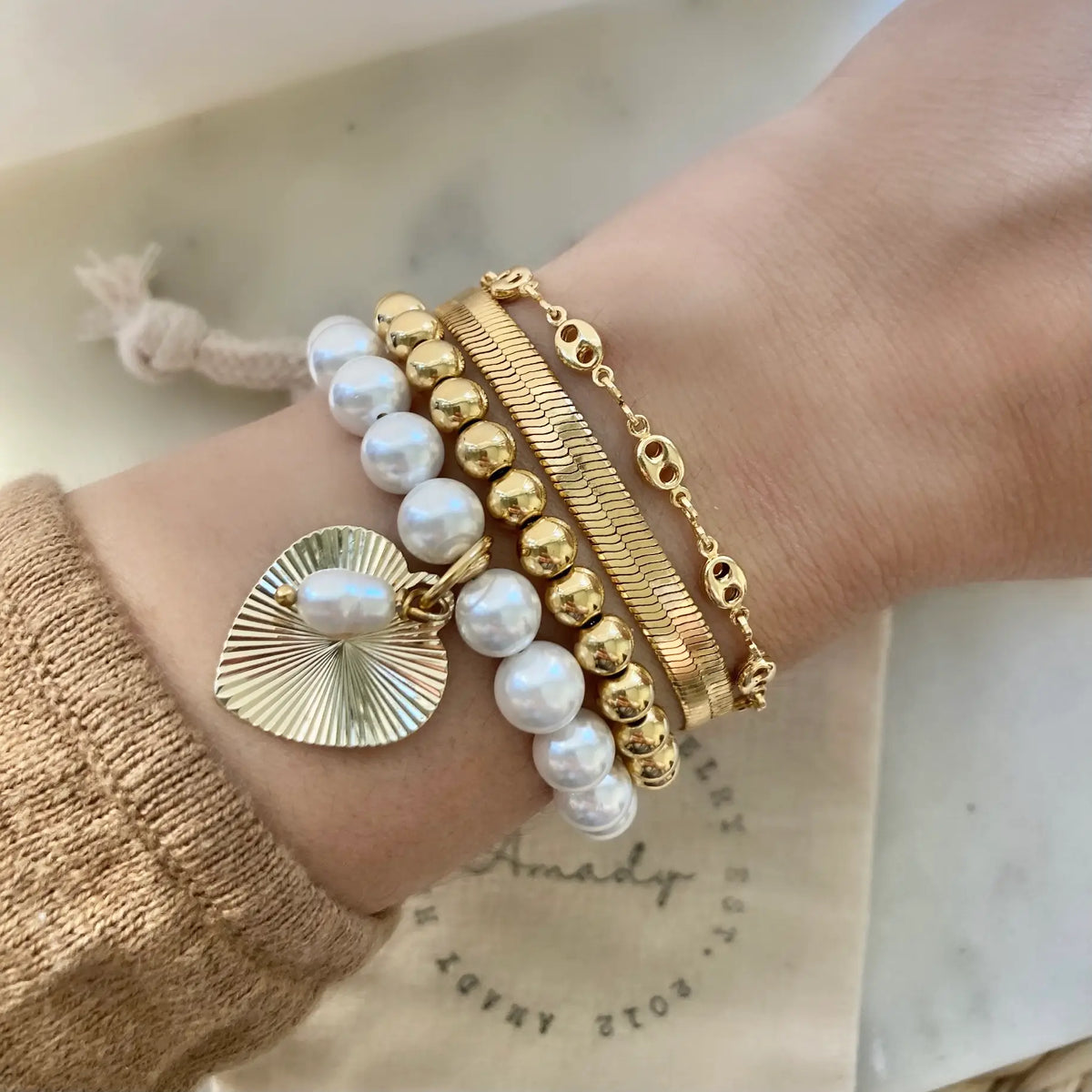Freshwater pearl gold heart charmed bracelet  coquette
